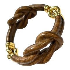 Bracelet en or jaune 18 carats et palissandre avec nœud papillon