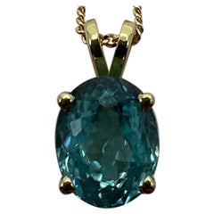Vivid Neon Blue Zircon 3.77 Carat Oval Cut 18k Yellow Gold Pendant Necklace
