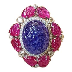 28.17 Carats, Natural Carved Tanzanite, Carved Ruby & Diamonds Cocktail Ring