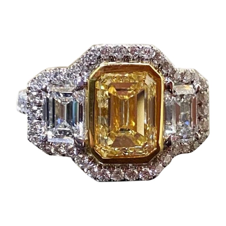 GIA Certified 3.02 Carat Emerald Cut Fancy Yellow Diamond Engagement Ring For Sale