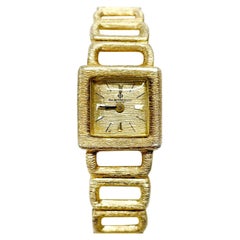 Montre-bracelet en or jaune Baume et Mercier<unk>