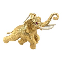 18KT Yellow Gold Elephant Brooch with Ruby Eyes & White Enamel Tusks