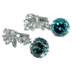 Earrings with Diamonds and Treated Light Blu Zircons in Gold 18 Karats