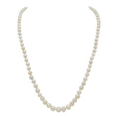 Filo di 85 perle naturali con chiusura in oro 15 carati e diamanti