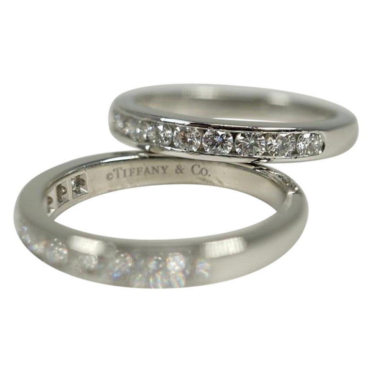 Pair of platinum and diamond rings by Tiffany and Co, these beauties can be worn together, separately or combined with other band rings.  Each ring supports a stated total of 0.33 cts of VS, G - H diamonds and tapers from 3.05 mm at the top to 2.60