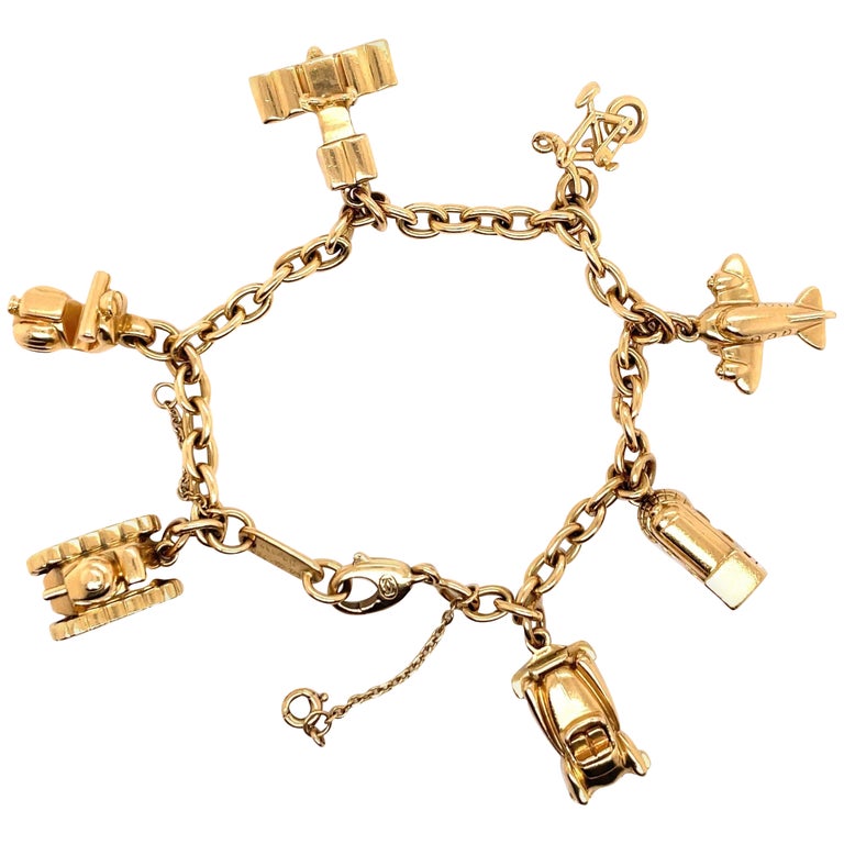 Cartier Bracelet à maillons de voyage à breloques en or jaune 18 carats 42  grammes En vente sur 1stDibs