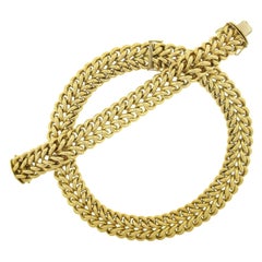 Deutschland, 18 Karat Gelbgold, Set aus schweren, doppelreihigen, gebogenen Gliederarmband und Halskette