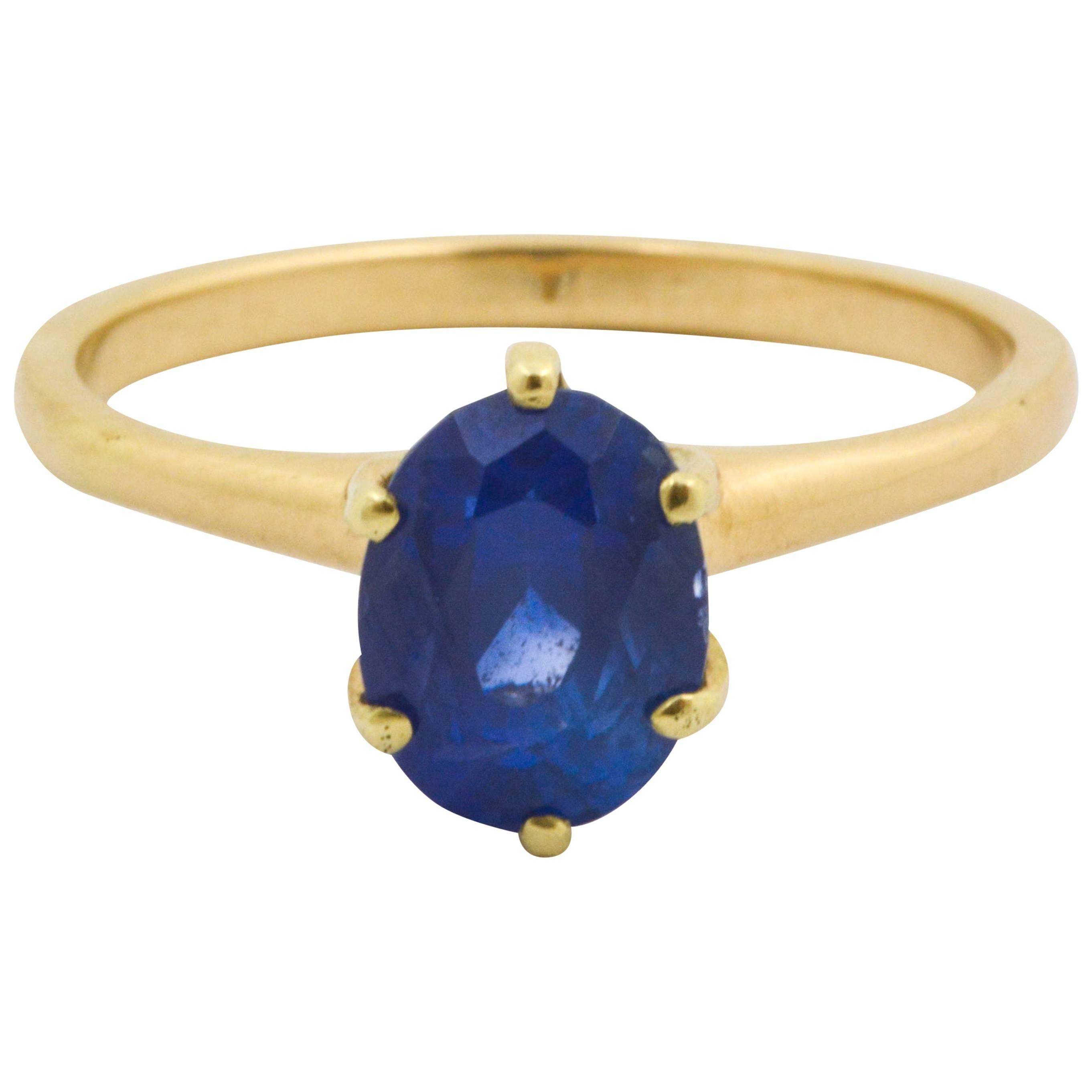 The simply sophisticated style of a 3.01 carat oval cut sapphire is set in a beautiful traditional solitaire ring. This Oval blue sapphire is set in a 14kt yellow gold ring. The sapphire’s intense blue color is sure to catch any eye in this