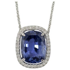 AGTA Certified None Heated Cushion Sapphire 7.87cts. Set in Diamond Halo Setting