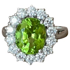 18 K white God Entourage Ring Peridot and Diamonds