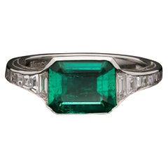 Hancocks Colombian Emerald Ring in Platinum Calibre Step-Cut Diamond Shoulders