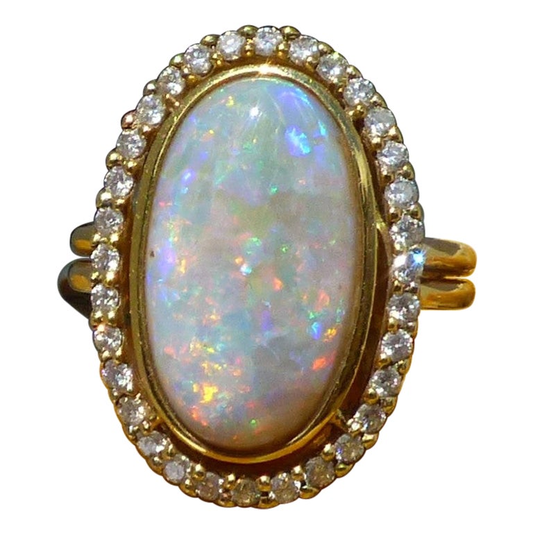 Long Oval Opal '5.79ct' and Diamond Cluster Ring in 18k Gold For Sale