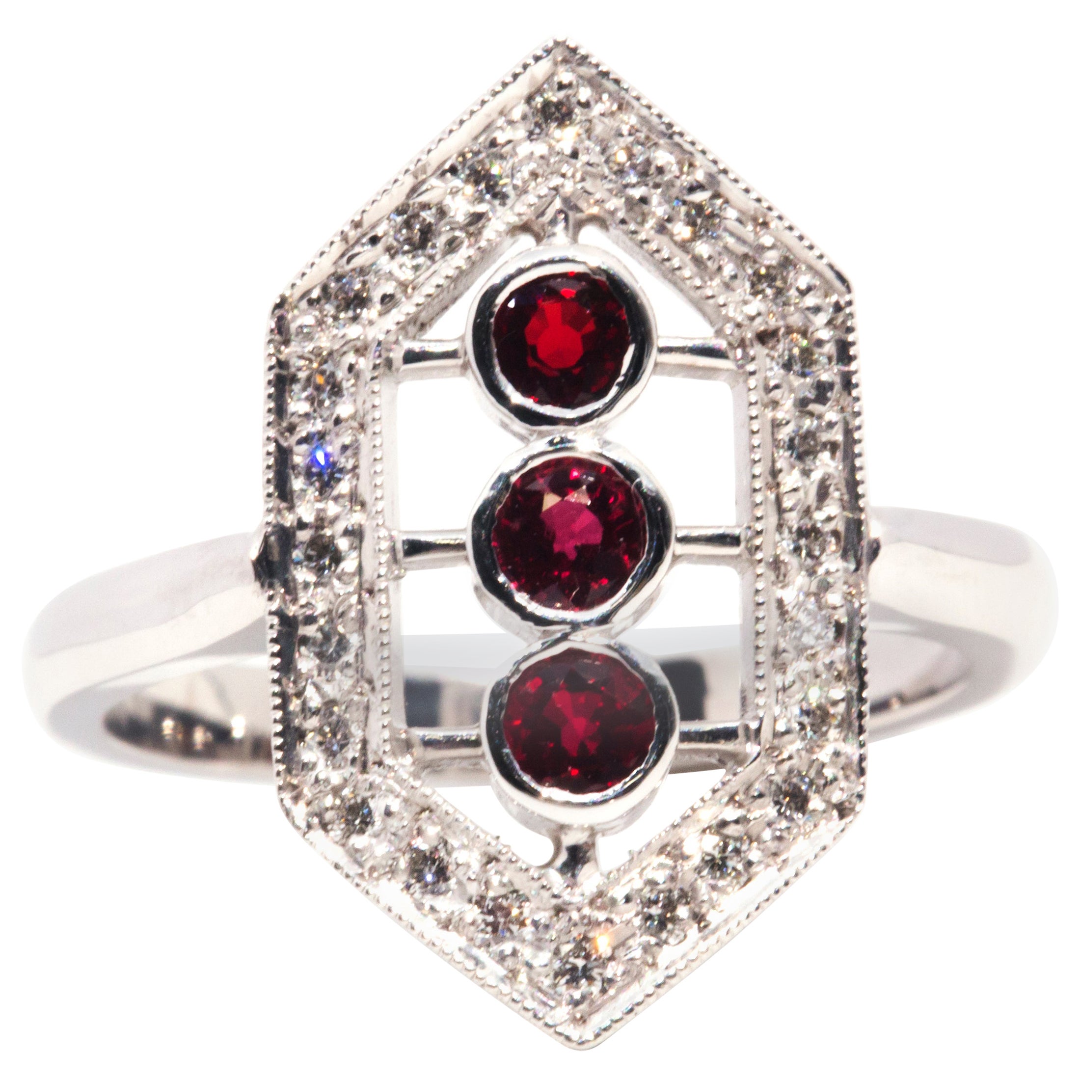 Circa 1970s, Red Ruby and Brilliant Diamond Cluster Ring 18 Carat White Gold For Sale
