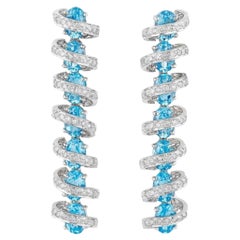 Diamond and Blue Topaz Earrings in 18 Karat White Gold