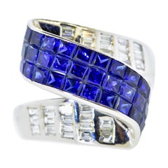 Invisibly Set Vivid Blue Sapphires and Diamond Ring