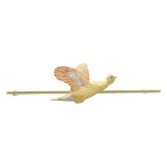 Broche antiguo de platino y oro amarillo y rosa con forma de pájaro