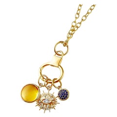 Syna Gelbgold-Halskette mit drei Anhängern Evil Eye mit Edelsteinen und Diamanten