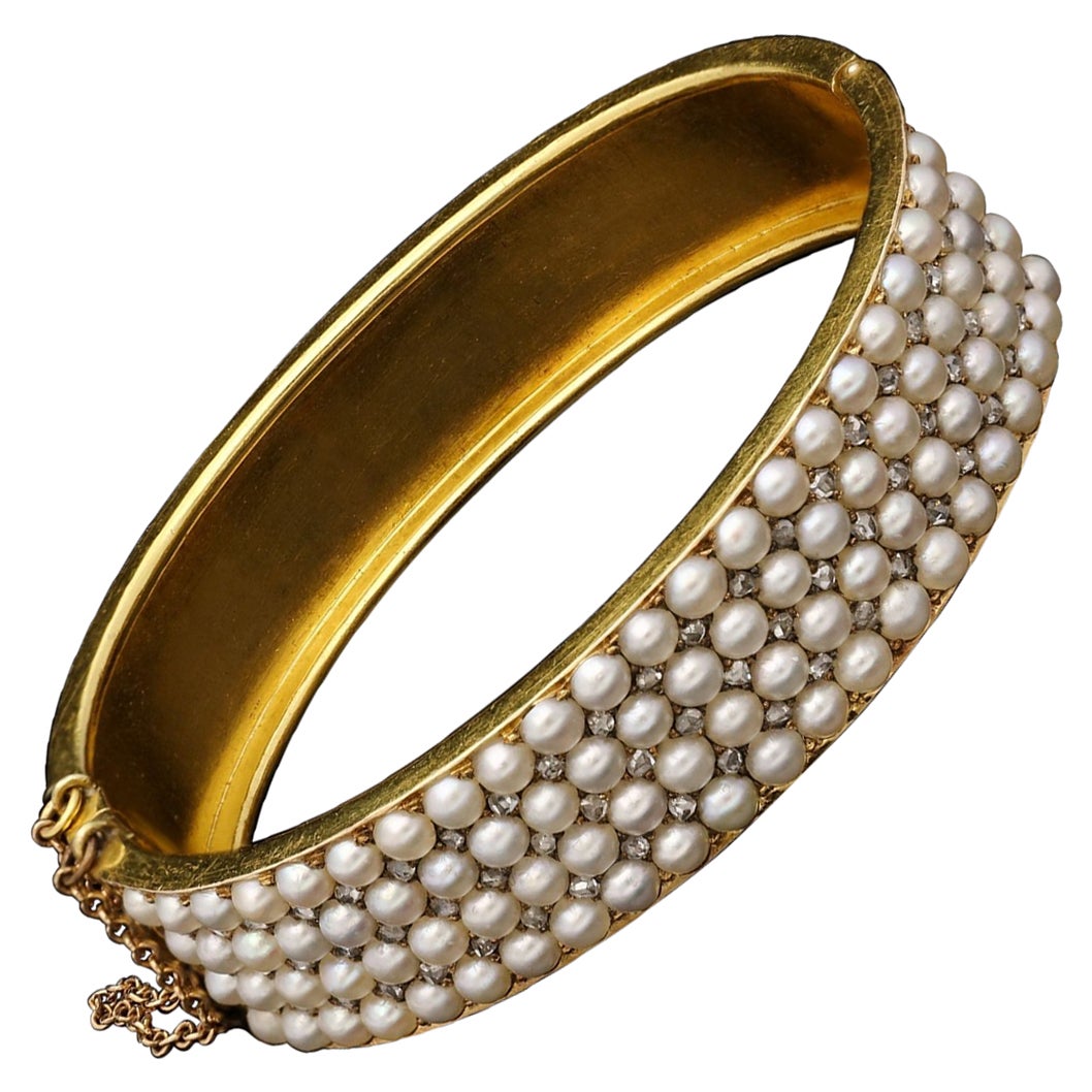 Antique Victorian Gold Pearl and Diamond Hinged Bangle, Circa 1880s For Sale