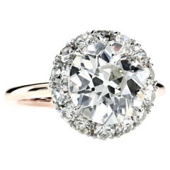 Halo Ring Featuring an OEC and Single Cut Diamonds by Leon Mege