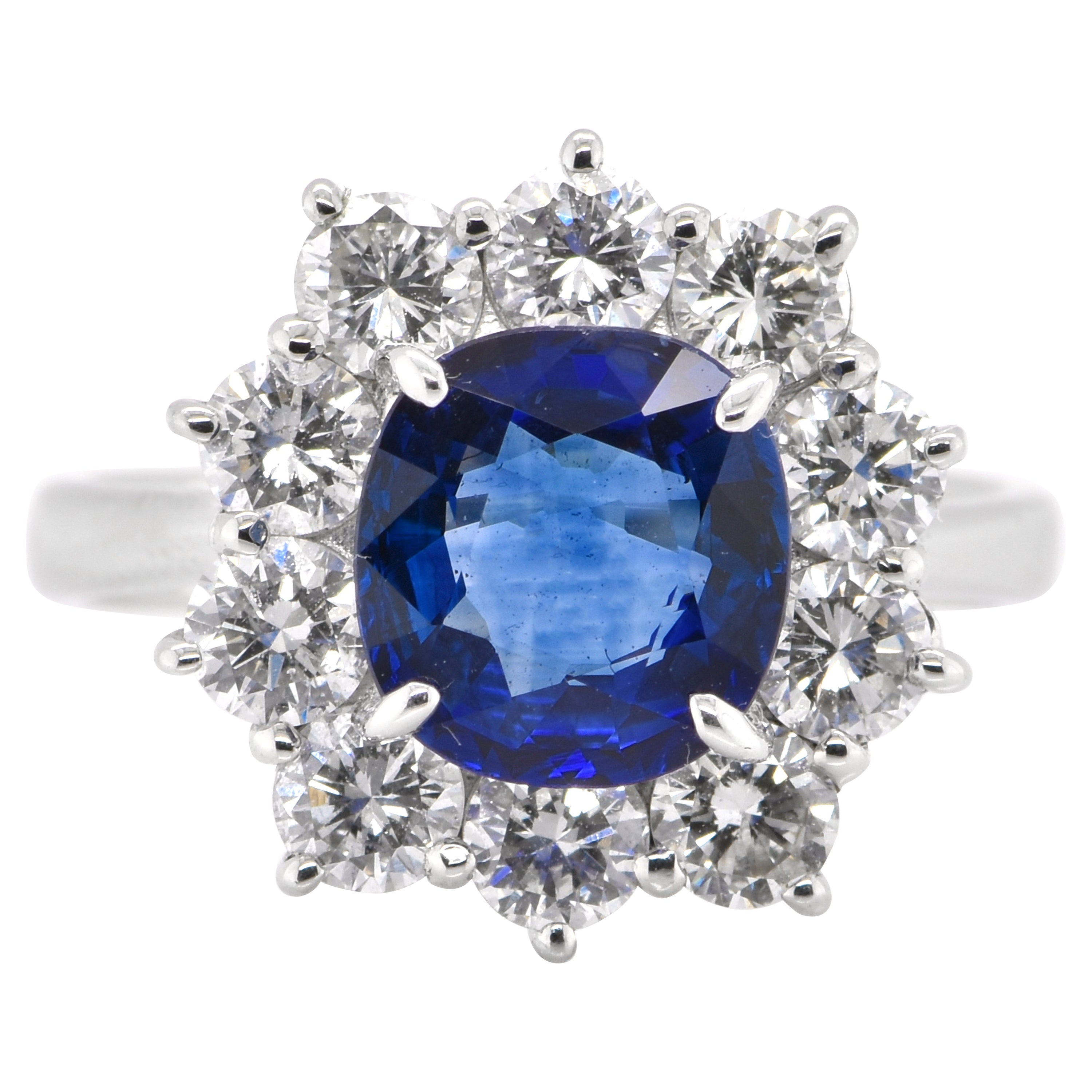 2.33 Carat Natural Sapphire and Diamond Halo Ring Set in Platinum