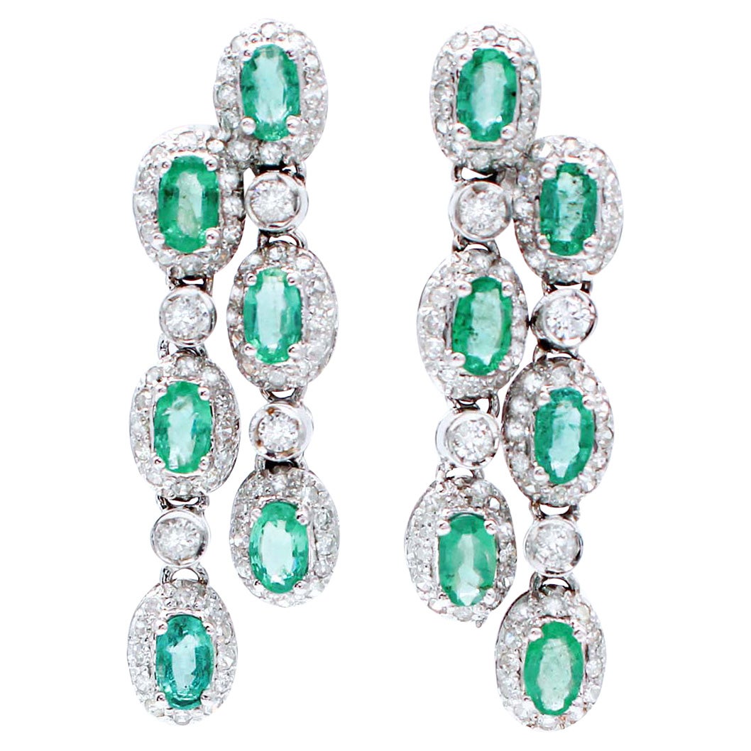 Emeralds, Diamonds, 14 Karat White Gold Dangle Earrings.