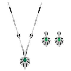 Art Deco Style Emerald, Black Onyx and Diamond Set in 18 Karat White Gold