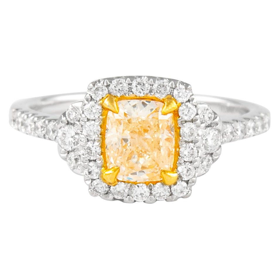 Alexander, bague bicolore 18 carats avec diamant jaune coussin fantaisie de 1,38 carat et halo