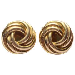Boucles d'oreilles Cartier en or avec nœud d'amour