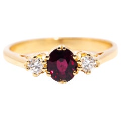 Red Deep Oval Ruby and Diamond Vintage Three Stone Ring 18 Carat Yellow Gold