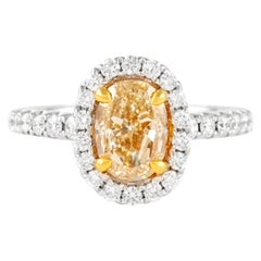 Alexander Bague bicolore 18 carats avec diamant jaune fantaisie ovale de 2,66 carats et halo