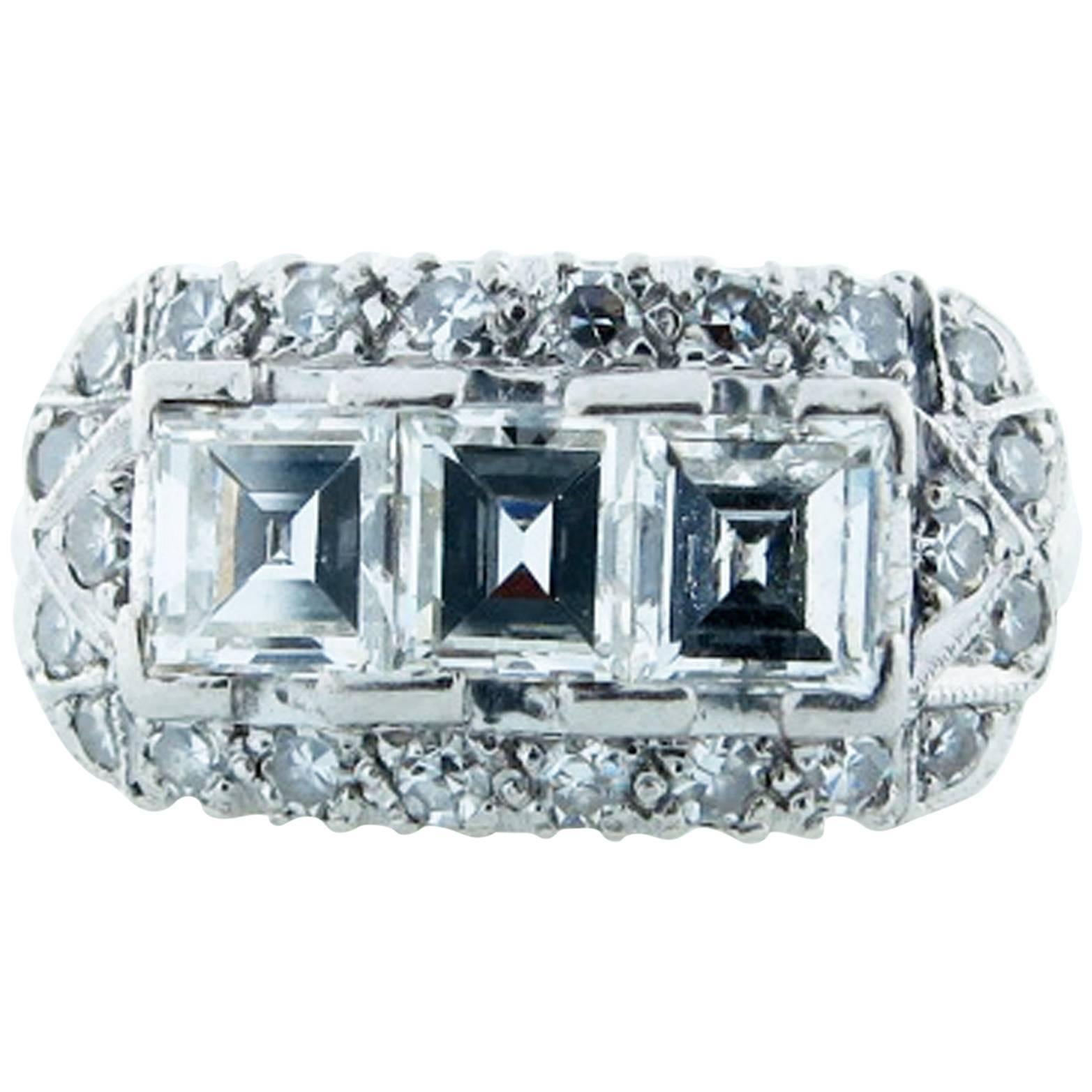 Exquisite Art Deco Three Stone Emerald Cut Diamond Platinum Ring For Sale