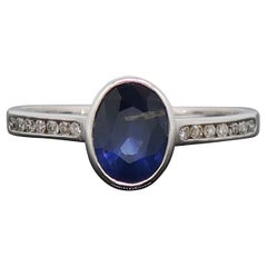 9 Karat White Gold Oval Sapphire Solitaire Ring with Diamond Shoulders