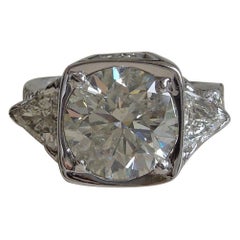 Round 5.10 Carat Solitaire and Trillion Cut Diamond Ring