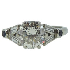 Vintage Art Deco 1.10 Carat Diamond Ring with Baguetee Diamond and Sapphire Shoulders