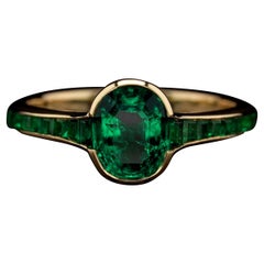 Hancocks 1.14ct Oval Colombian Emerald, Emerald Shoulders And 18ct Gold Ring
