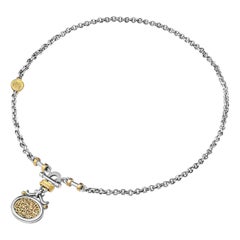 Collana calligrafica con chiusura a T in oro 18 carati, argento e granato