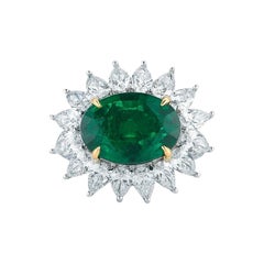 Oval Emerald Ring with Diamond Halo
