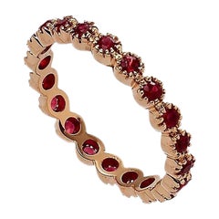 Anello Eternity en or rose 18 carats et rubis