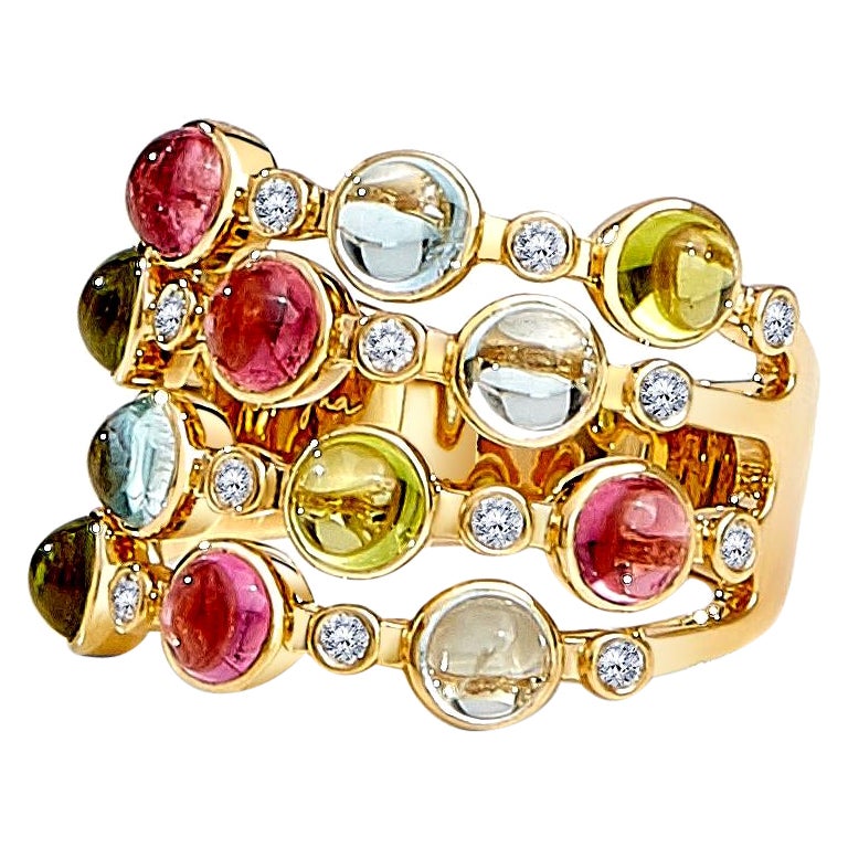 Anillo Syna de Oro Amarillo con Rubelita, Peridoto, Aguamarina y Diamantes en venta