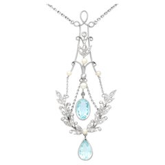 Pendentif en or jaune avec aigue-marine, diamant et perle