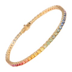 Alexander Tennisarmband aus 18 Karat Gelbgold mit 6,21 Karat Regenbogen-Saphir