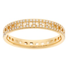Ring 18k rose gold with diamonds.  Tiffany & Co. True T Narrow 