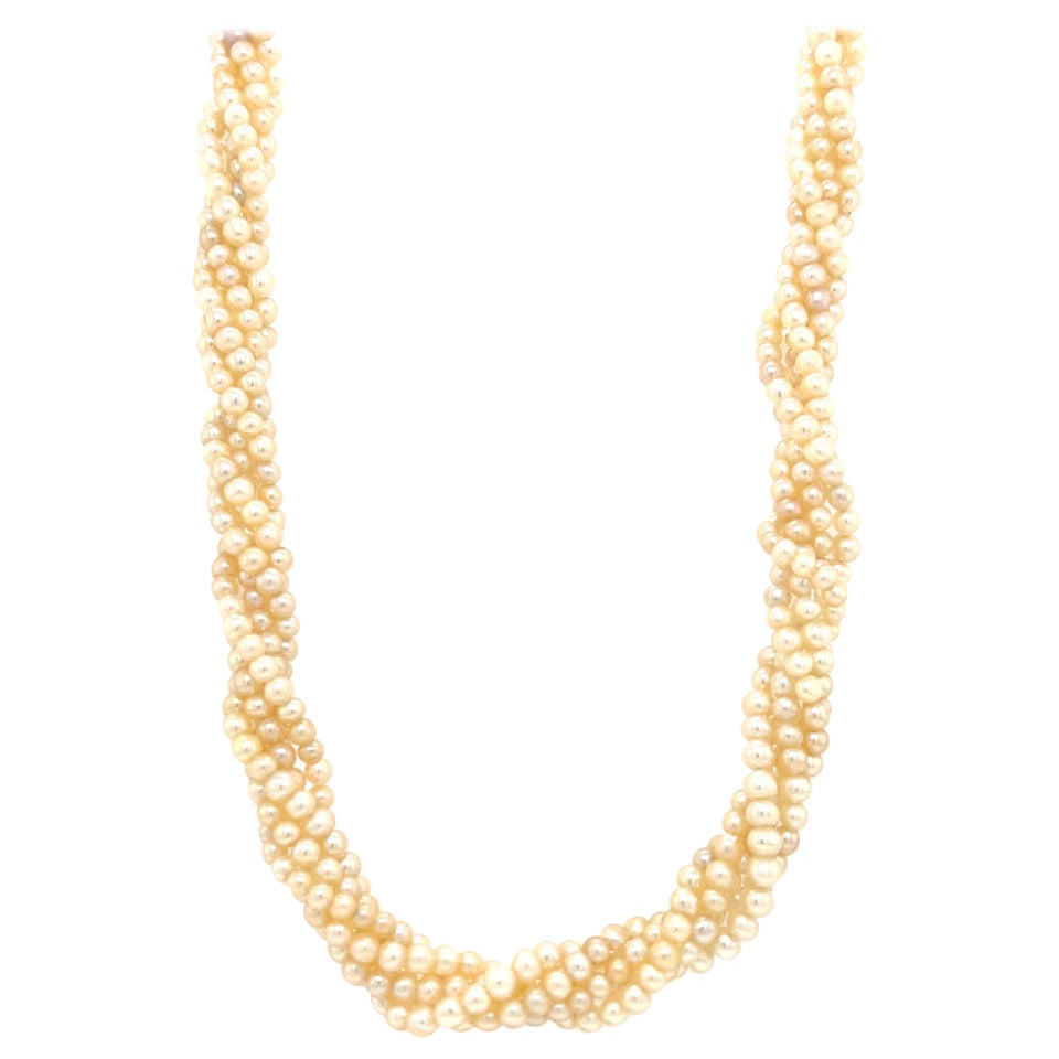 Elegant necklace crafted in the Art Deco era. This one of a kind treasure showcases five strands of pearls that are intwined to show a twisted rope style when worn. The pearls are strung tightly so this look stays in tact and secure when worn.  The