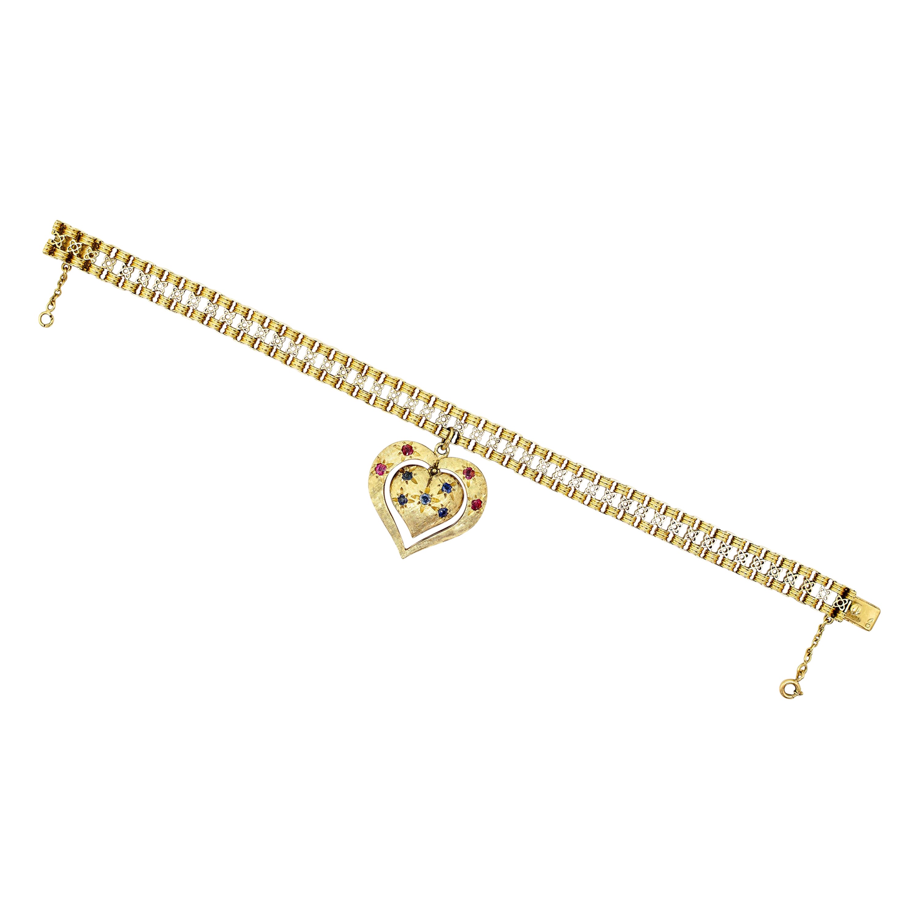 Mid-Century Yellow Gold Bracelet with an Articulated Double Sided Gem Heart Char For Sale