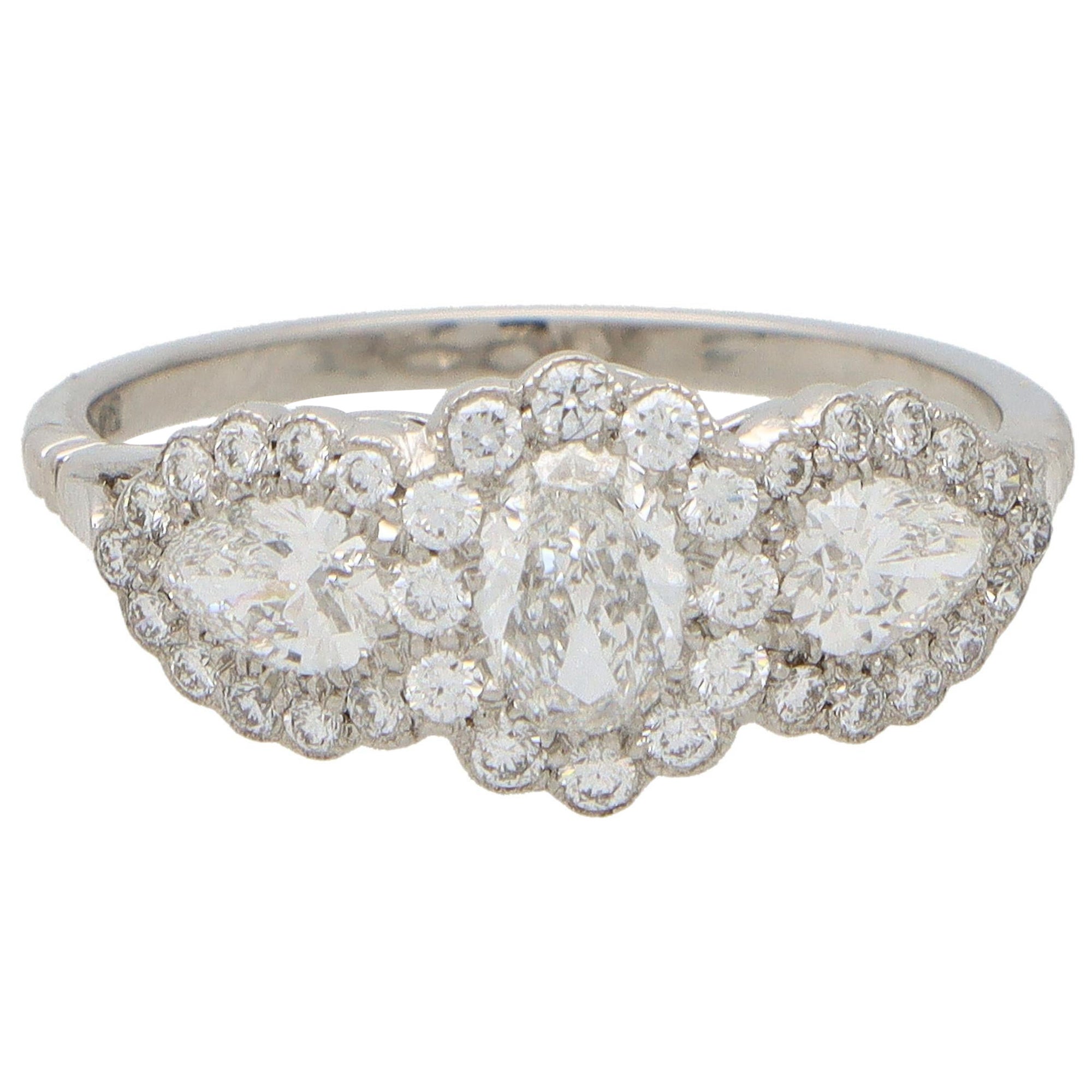 Oval Diamond Floral Cluster Three Stone Ring Set in Platinum