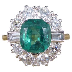 Contemporary 2.08ct Emerald and 1.25ct Diamond Cluster Ring in 18ct Gold