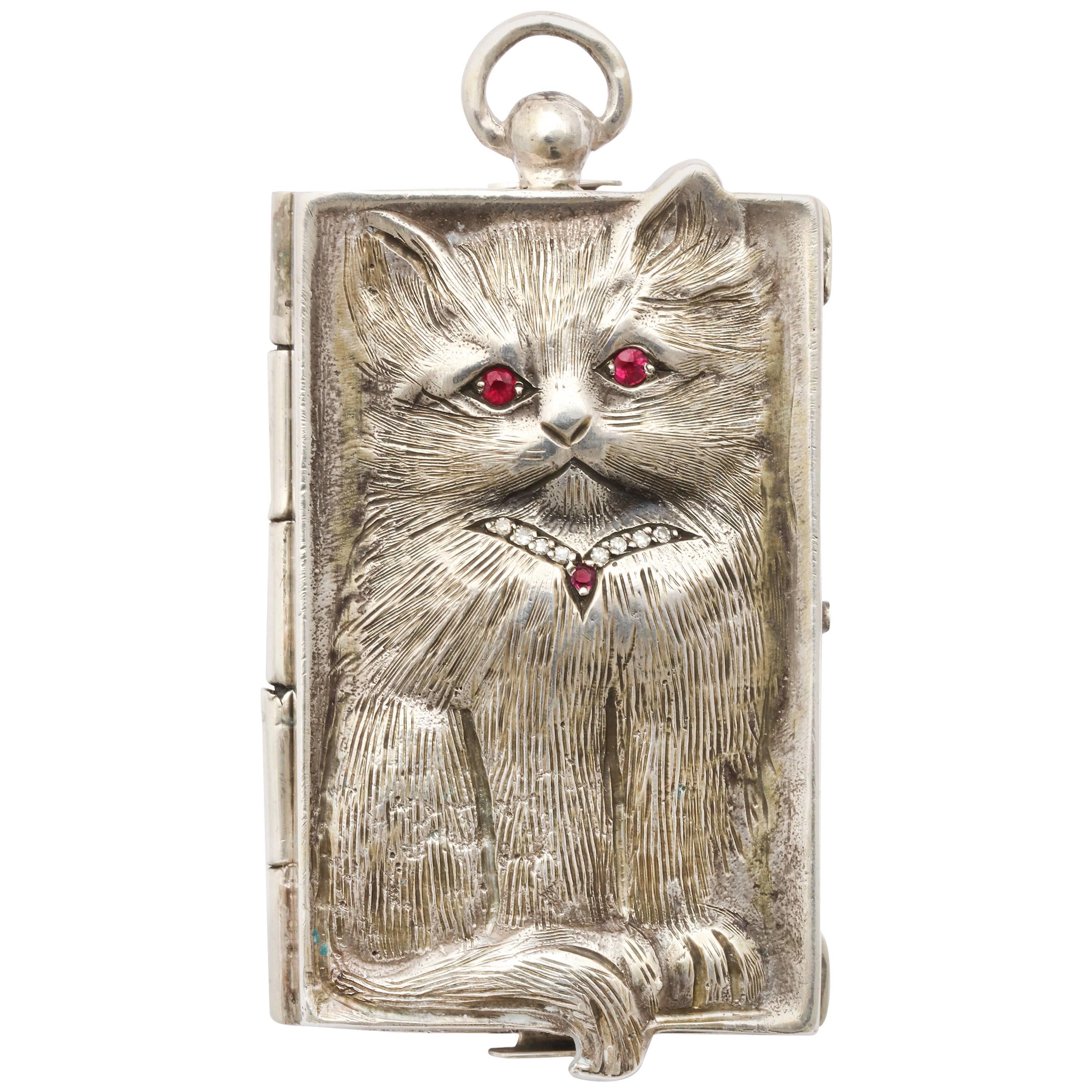  Silver Pendant of a Cuddlesome Kitty with Ruby Eyes