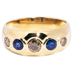 circa 1980s, 18 Carat Gold Sapphire and Cognac Diamond Vintage Five Stone Ring