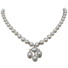 Round Pearl Necklace with Baroque Pearl Centerpiece and Gold Findings 4
