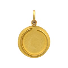 Medaglione 'Enso' in oro 18 carati